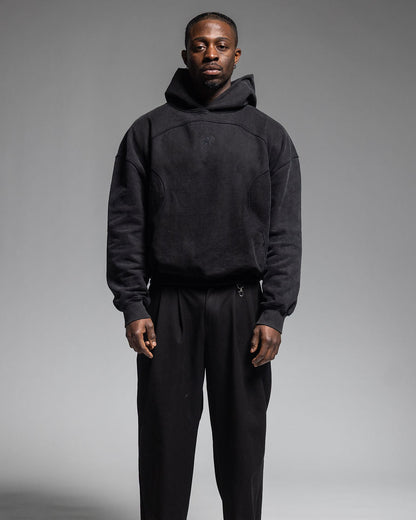 Man wearing Trew Collections Black on Black Hoodie Front Facing